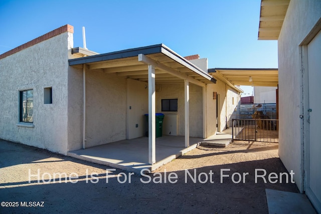 exterior space with stucco siding