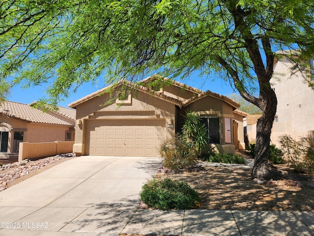 60464 E Blackcrest Loop, Tucson, AZ 85739 - view of front of house with stucco siding, driveway, a tile roof, and a garage