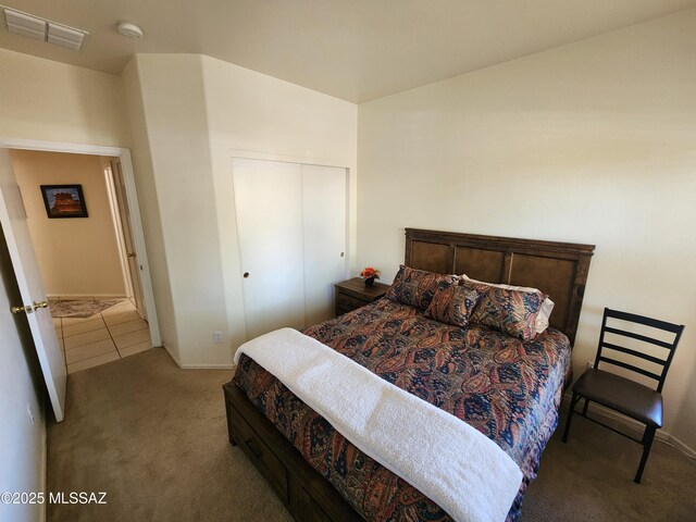 60464 E Blackcrest Loop, Tucson, AZ 85739 - bedroom with carpet floors, baseboards, a closet, and visible vents