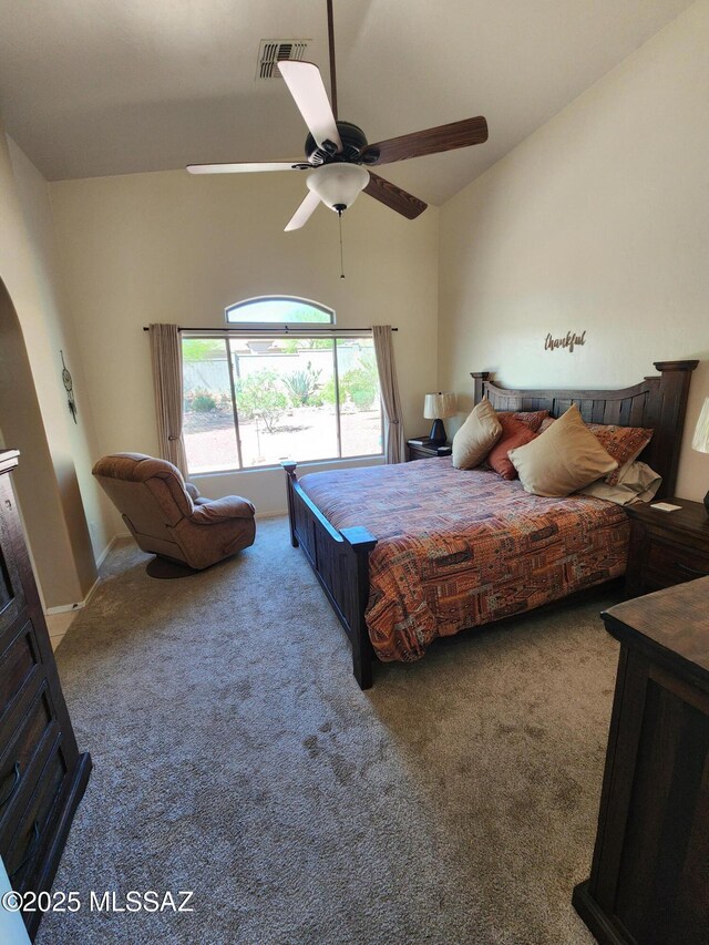 60464 E Blackcrest Loop, Tucson, AZ 85739 - carpeted bedroom with visible vents, arched walkways, a ceiling fan, and vaulted ceiling