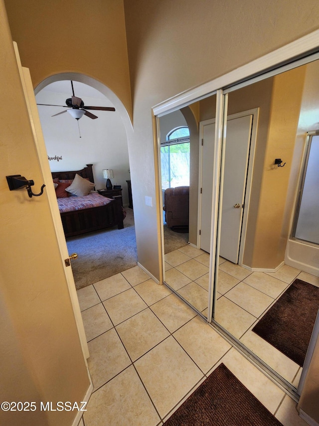 60464 E Blackcrest Loop, Tucson, AZ 85739 - interior space with arched walkways and light tile patterned floors
