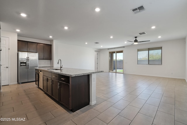 3352 W Shadow Park Way, Tucson, AZ 85742 - kitchen with stainless steel refrigerator with ice dispenser, a sink, dark brown cabinets, open floor plan, and a ceiling fan