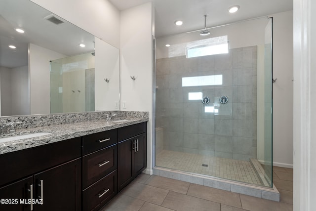 3352 W Shadow Park Way, Tucson, AZ 85742 - bathroom with double vanity, a stall shower, tile patterned flooring, and recessed lighting