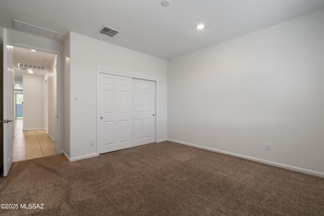 3352 W Shadow Park Way, Tucson, AZ 85742 - unfurnished bedroom featuring light carpet, baseboards, a closet, and recessed lighting