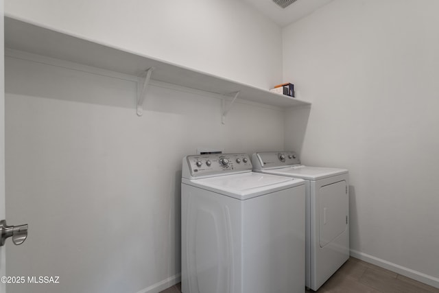 3352 W Shadow Park Way, Tucson, AZ 85742 - washroom with washer and clothes dryer and baseboards
