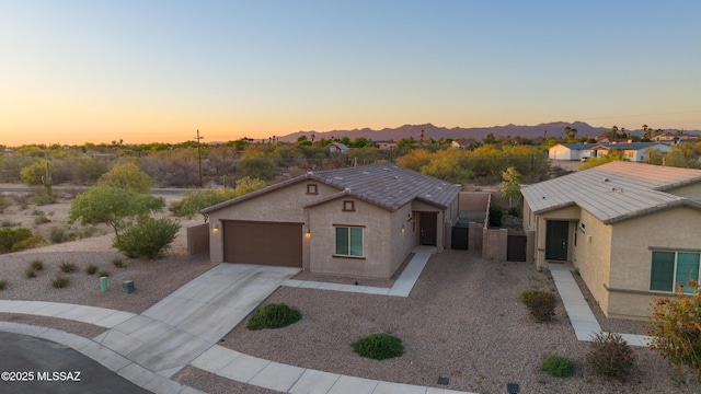 3352 W Shadow Park Way, Tucson, AZ 85742 - single story home featuring concrete driveway, an attached garage, stucco siding, and a mountain view