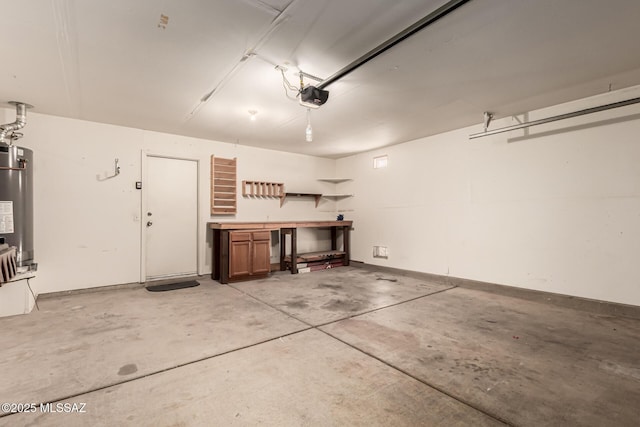 garage featuring water heater, a workshop area, and a garage door opener