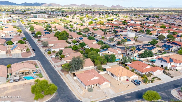 birds eye view of property with a mountain view and a residential view