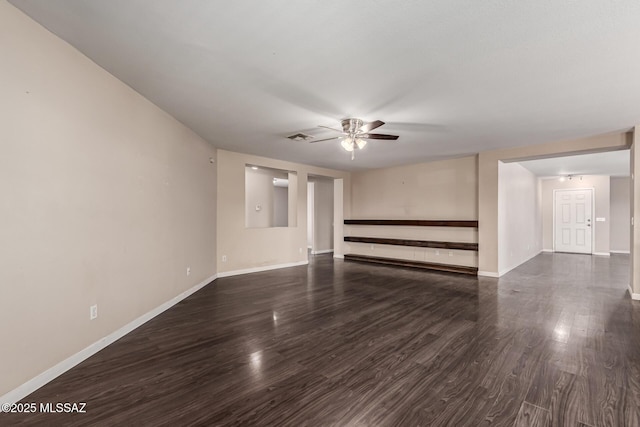unfurnished living room with visible vents, baseboards, dark wood-type flooring, and ceiling fan