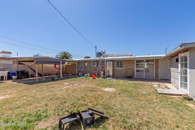 back of house with a yard