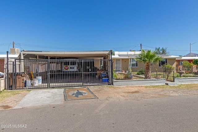 view of front facade with a gate, central AC, and a fenced front yard