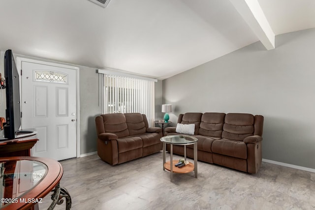 living room with baseboards and beam ceiling