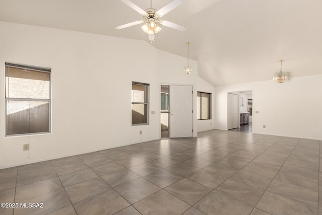 spare room featuring plenty of natural light, a ceiling fan, high vaulted ceiling, and tile patterned floors