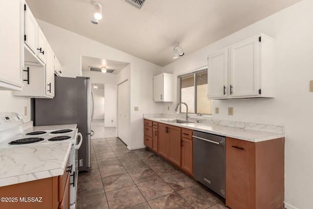 kitchen with white range with electric cooktop, vaulted ceiling, a sink, dishwasher, and light countertops