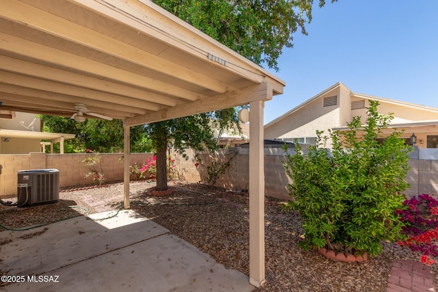 view of patio / terrace featuring central air condition unit, a fenced backyard, and ceiling fan