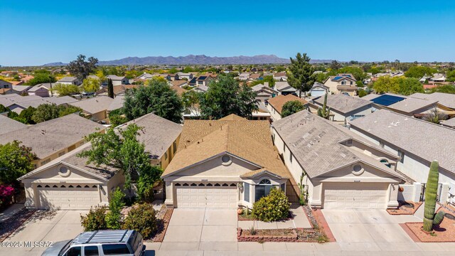 drone / aerial view with a mountain view and a residential view