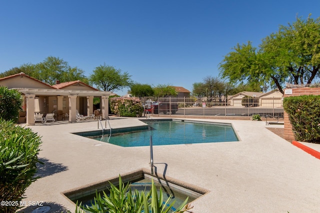 pool with fence and a patio area