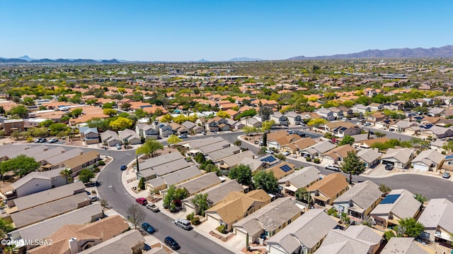 drone / aerial view featuring a residential view and a mountain view