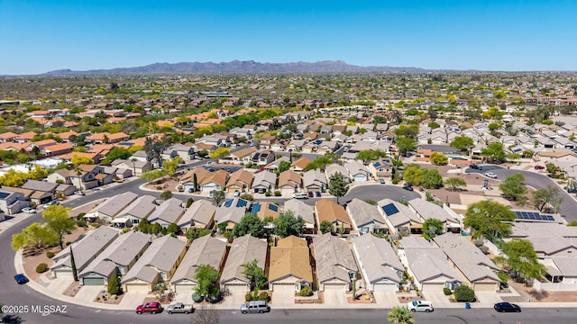 birds eye view of property featuring a mountain view and a residential view