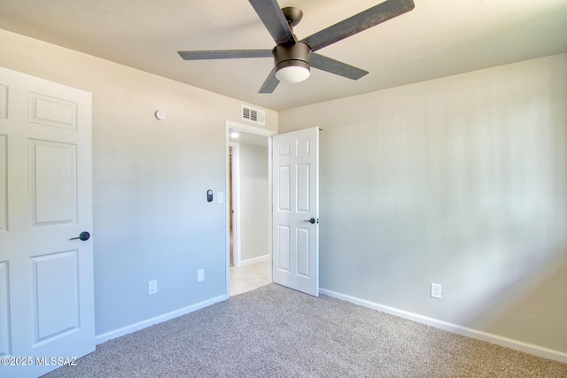 5754 S Ray Stra, Tucson, AZ 85706 - unfurnished bedroom featuring baseboards, visible vents, a ceiling fan, and carpet