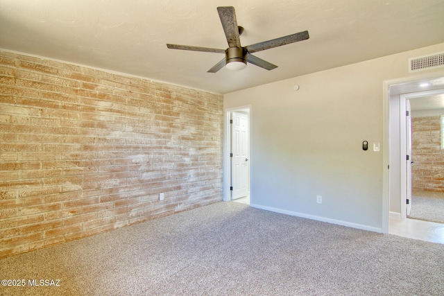 5754 S Ray Stra, Tucson, AZ 85706 - carpeted empty room with ceiling fan, visible vents, brick wall, and baseboards