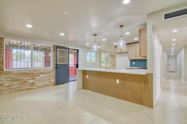 5754 S Ray Stra, Tucson, AZ 85706 - kitchen with recessed lighting, a sink, light countertops, visible vents, and pendant lighting