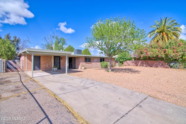 5754 S Ray Stra, Tucson, AZ 85706 - ranch-style house with a gate, brick siding, fence, and a carport