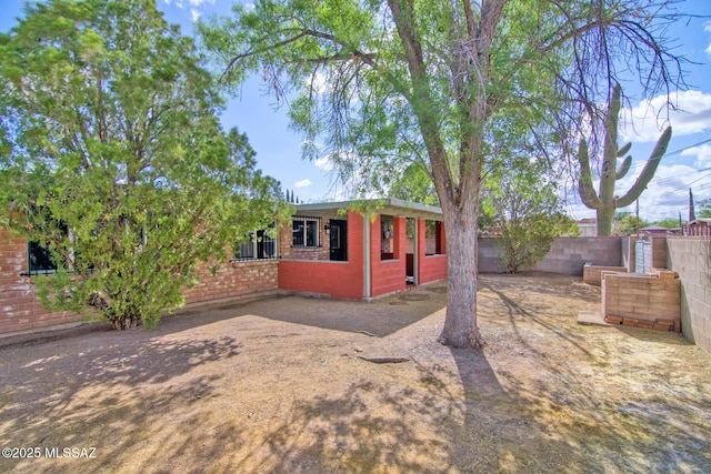 5754 S Ray Stra, Tucson, AZ 85706 - view of front of property with brick siding and a fenced backyard