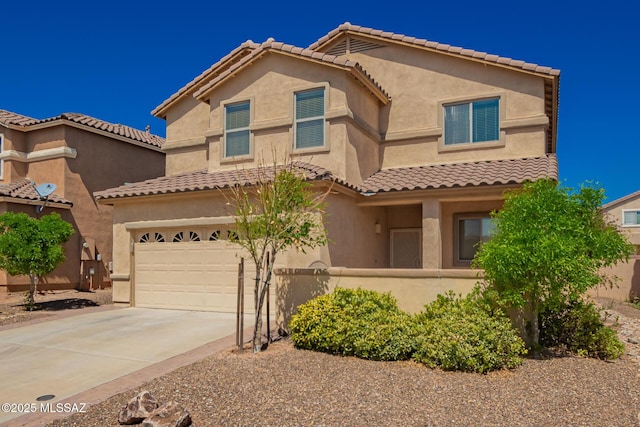 mediterranean / spanish house with fence, a tile roof, driveway, and stucco siding