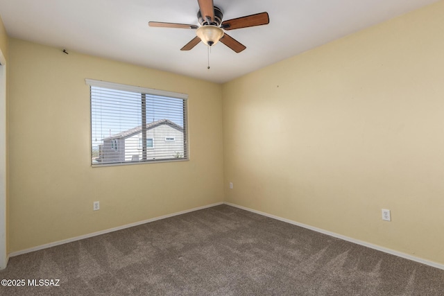 unfurnished room with baseboards, carpet flooring, and ceiling fan
