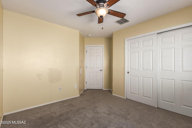 unfurnished bedroom with a closet, ceiling fan, baseboards, carpet flooring, and visible vents