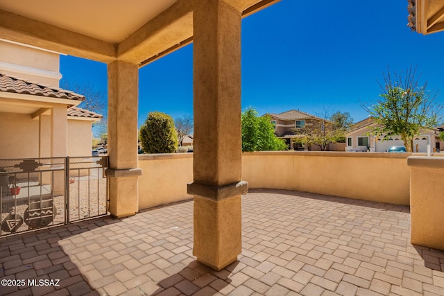 view of patio / terrace featuring fence