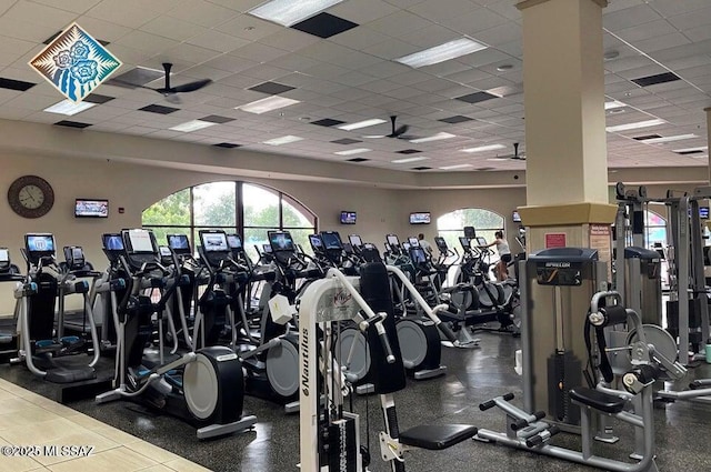 exercise room featuring a paneled ceiling and visible vents