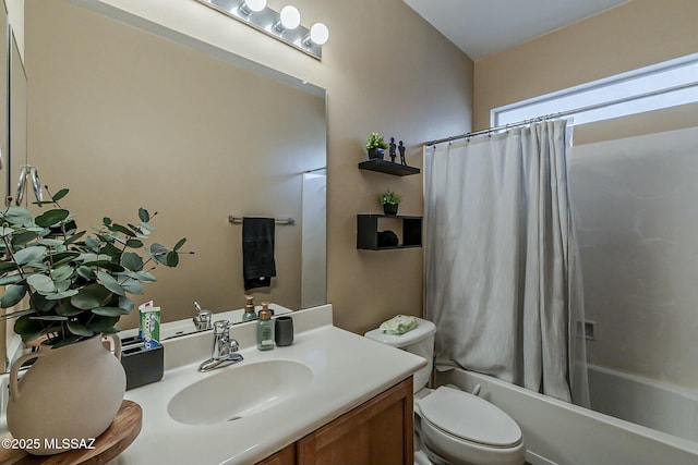 bathroom featuring shower / tub combo, toilet, and vanity