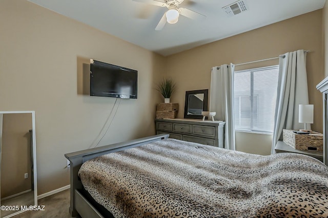 carpeted bedroom with baseboards, a ceiling fan, and visible vents