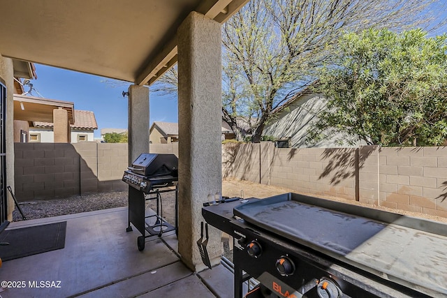 view of patio featuring a fenced backyard and area for grilling
