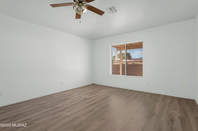 2145 N Horseshoe Trl, Tucson, AZ 85745 - unfurnished room featuring wood finished floors and a ceiling fan