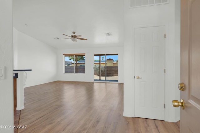 2145 N Horseshoe Trl, Tucson, AZ 85745 - unfurnished living room featuring wood finished floors and ceiling fan