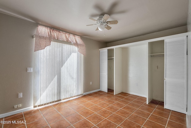 unfurnished bedroom featuring tile patterned flooring and ceiling fan