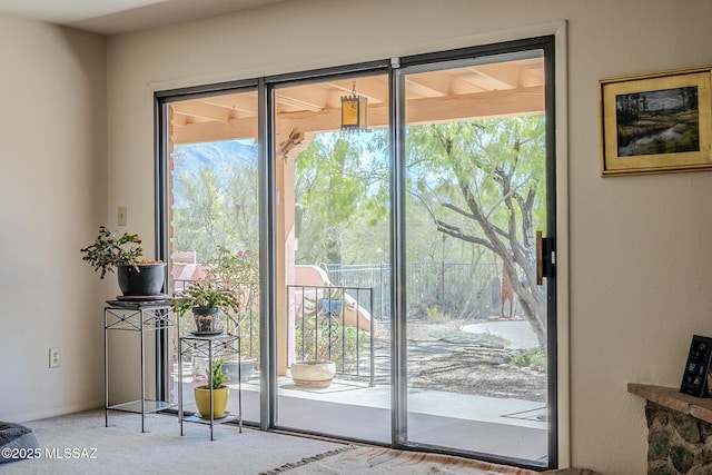 5140 N Via Condesa, Tucson, AZ 85718 - doorway to outside featuring carpet flooring and healthy amount of natural light