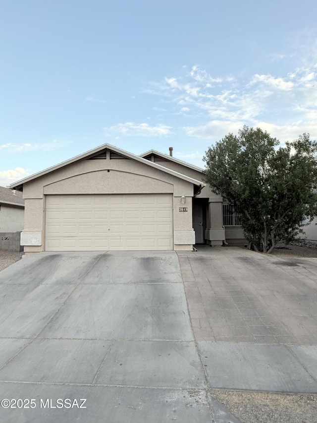 2019 W Calle Cielo De Oro, Tucson, AZ 85746 - view of front of home featuring stucco siding and concrete driveway