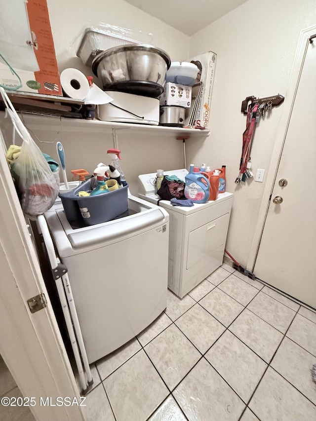 2019 W Calle Cielo De Oro, Tucson, AZ 85746 - washroom featuring washer and clothes dryer, laundry area, and light tile patterned floors