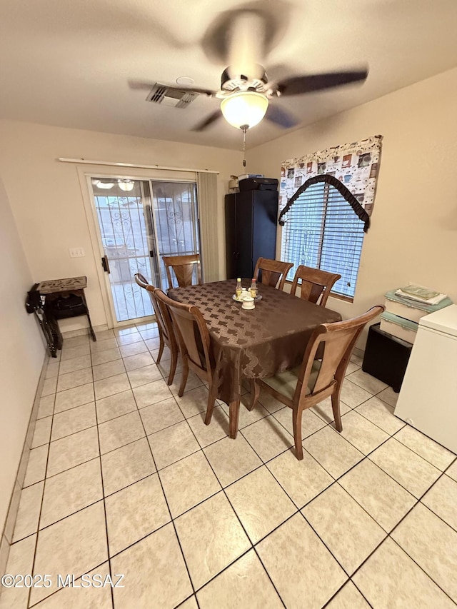 2019 W Calle Cielo De Oro, Tucson, AZ 85746 - dining space featuring light tile patterned flooring, visible vents, and a ceiling fan