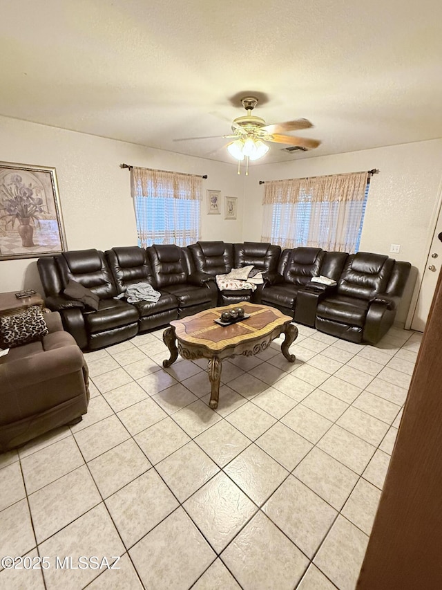 2019 W Calle Cielo De Oro, Tucson, AZ 85746 - living area featuring a textured ceiling, ceiling fan, and light tile patterned floors
