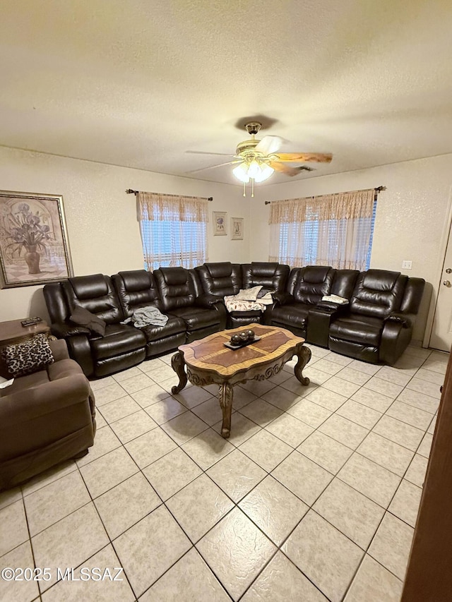 2019 W Calle Cielo De Oro, Tucson, AZ 85746 - living room featuring a textured ceiling, a ceiling fan, and light tile patterned floors