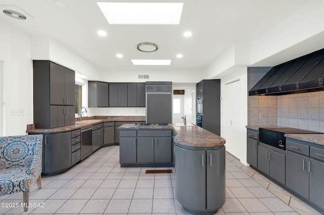 6210 N Camino Pimeria Alta, Tucson, AZ 85718 - kitchen with a kitchen island, dishwasher, a sink, a skylight, and gray cabinets