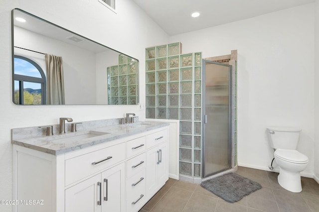 6210 N Camino Pimeria Alta, Tucson, AZ 85718 - full bath with a stall shower, double vanity, toilet, tile patterned floors, and baseboards
