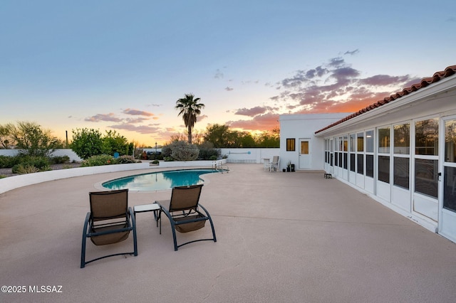 6210 N Camino Pimeria Alta, Tucson, AZ 85718 - pool at dusk featuring a patio area