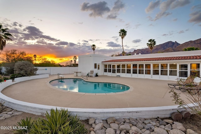 6210 N Camino Pimeria Alta, Tucson, AZ 85718 - pool at dusk featuring a patio area