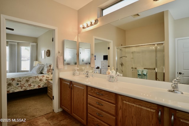 full bathroom with visible vents, a stall shower, ensuite bathroom, and a sink